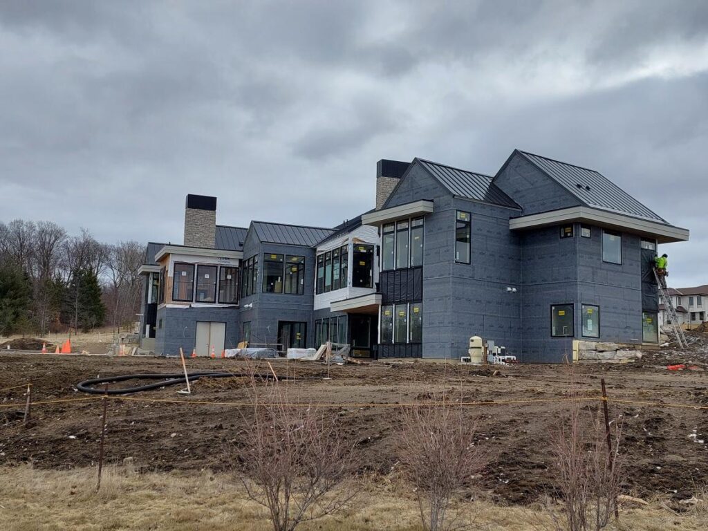 Minnesota Black Metal Roof Custom Home from Minnesota Metal Exteriors.